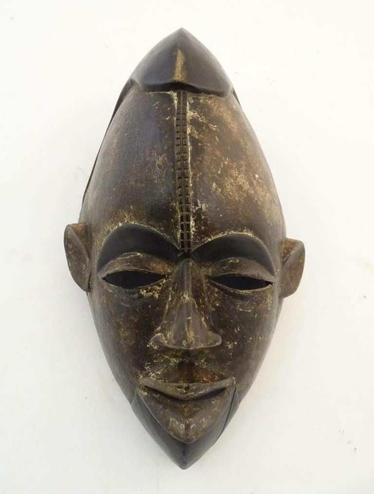 Spiritual Resonance: African Carved Hardwood Mask with Polychrome Detail