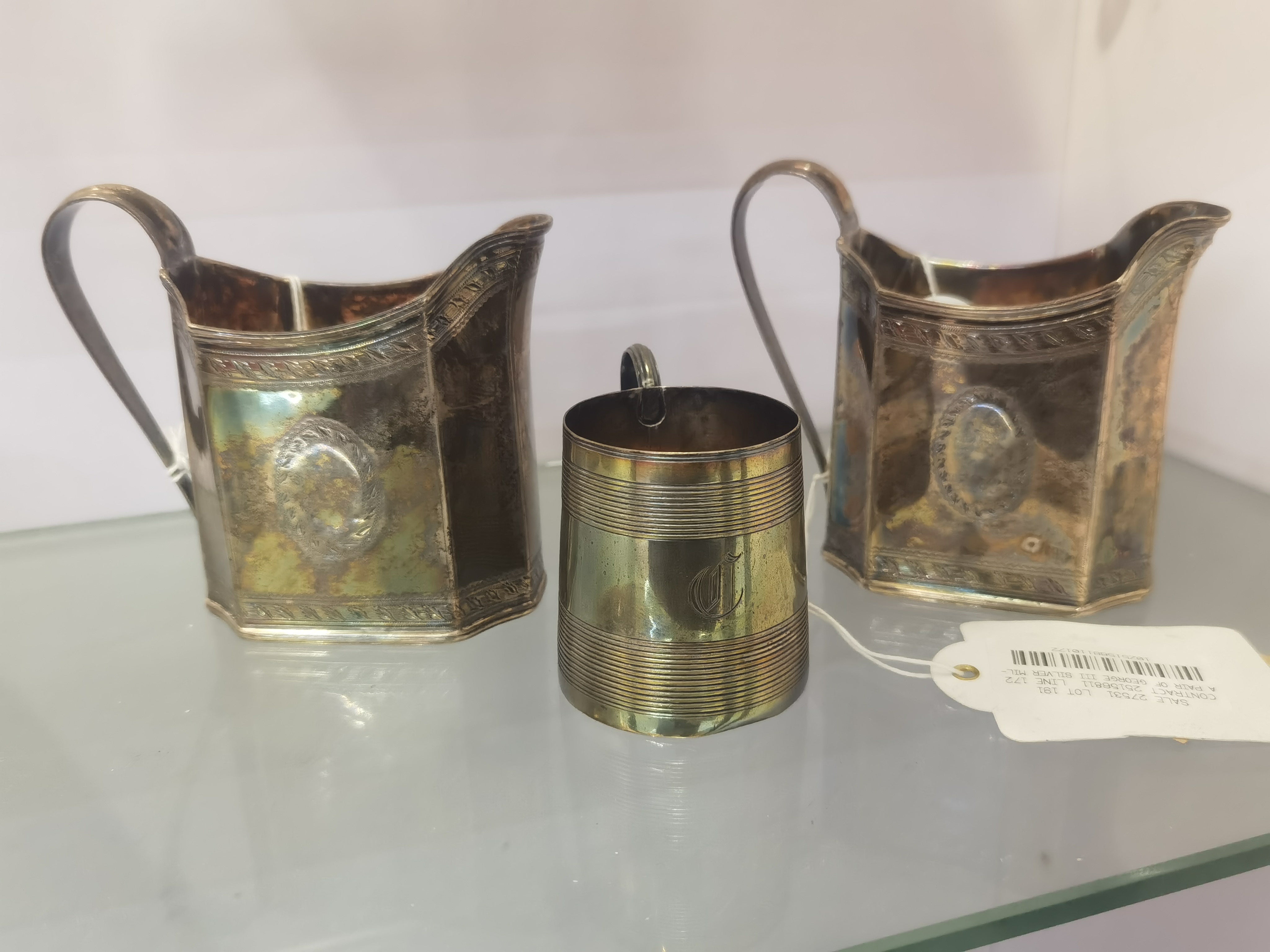 A Pair of George III Silver Milk Jugs and a Silver Christening Cup