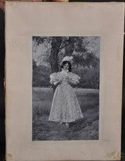 Maurice Levis 'Young Girl Holding A Flower'