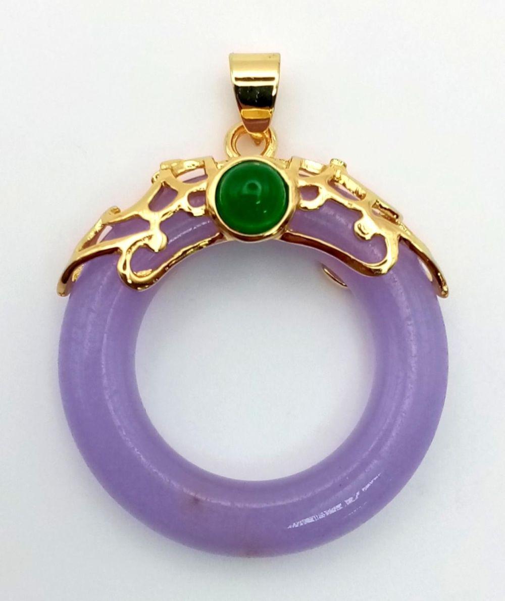 A Lavender Jade Doughnut Pendant on Gilded Attachment