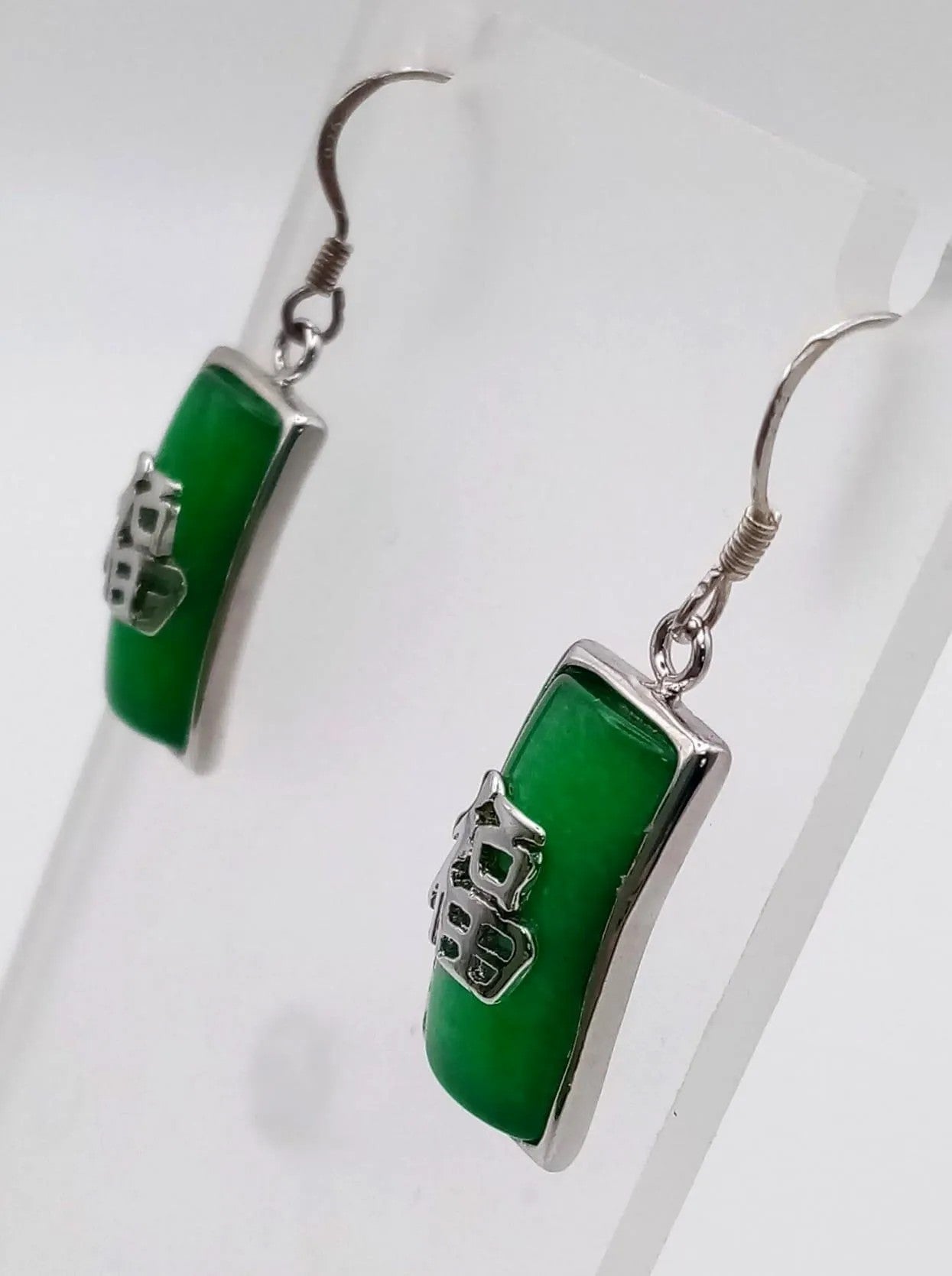 Pair of Emerald-Adorned Sterling Silver Oriental Earrings