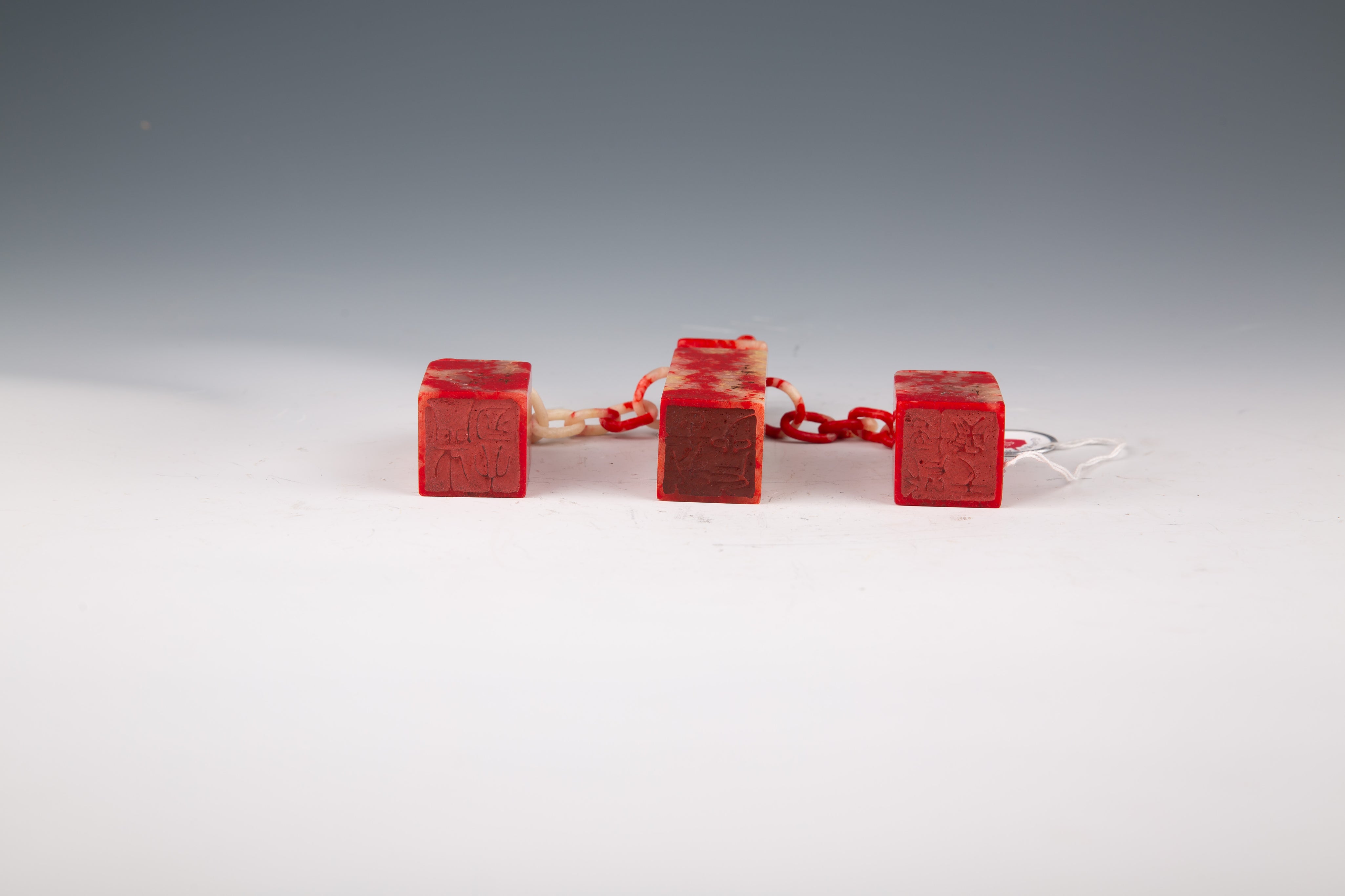 Three Chinese Jixue Blood Stone Seals Linked by Chain in Original Box