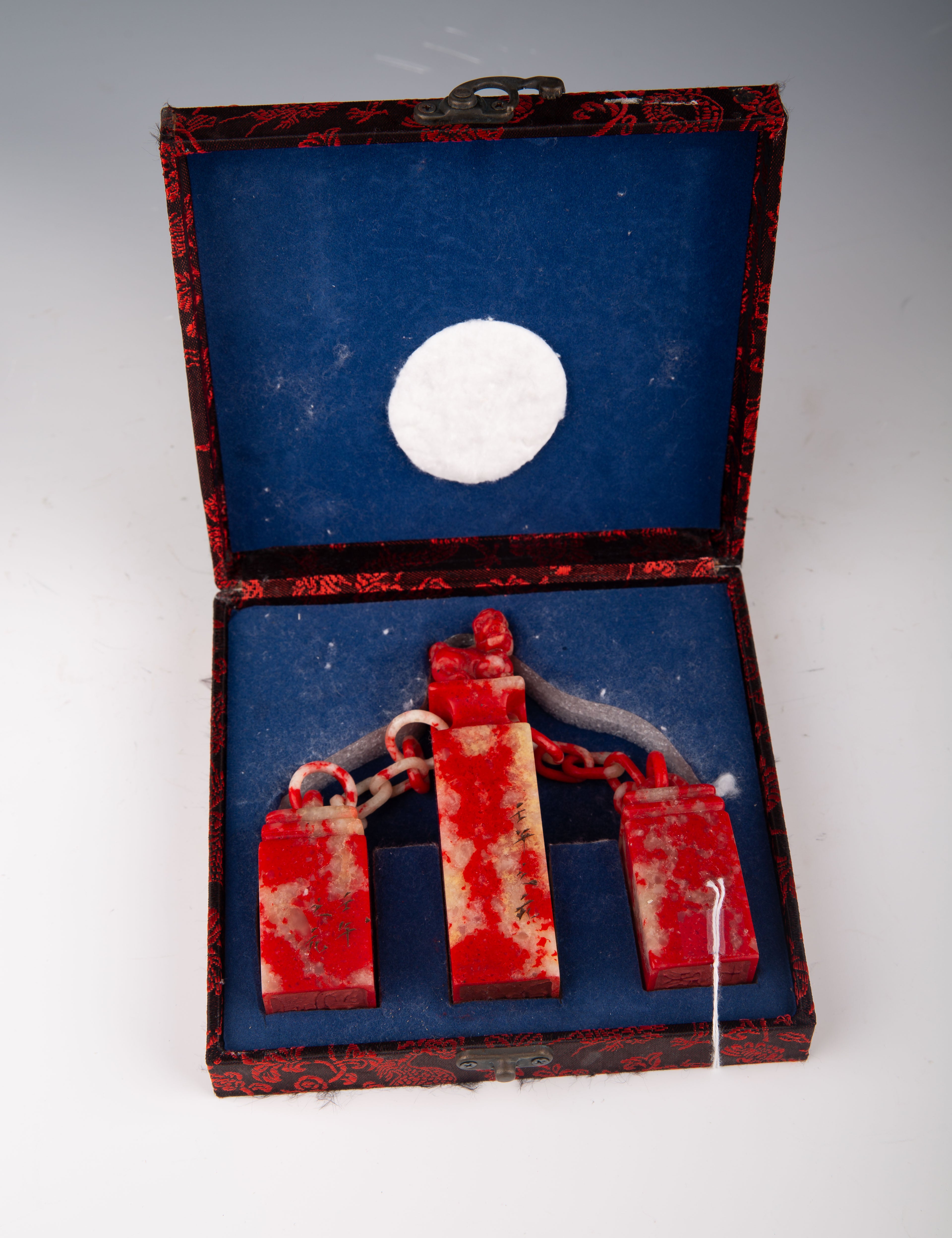 Three Chinese Jixue Blood Stone Seals Linked by Chain in Original Box