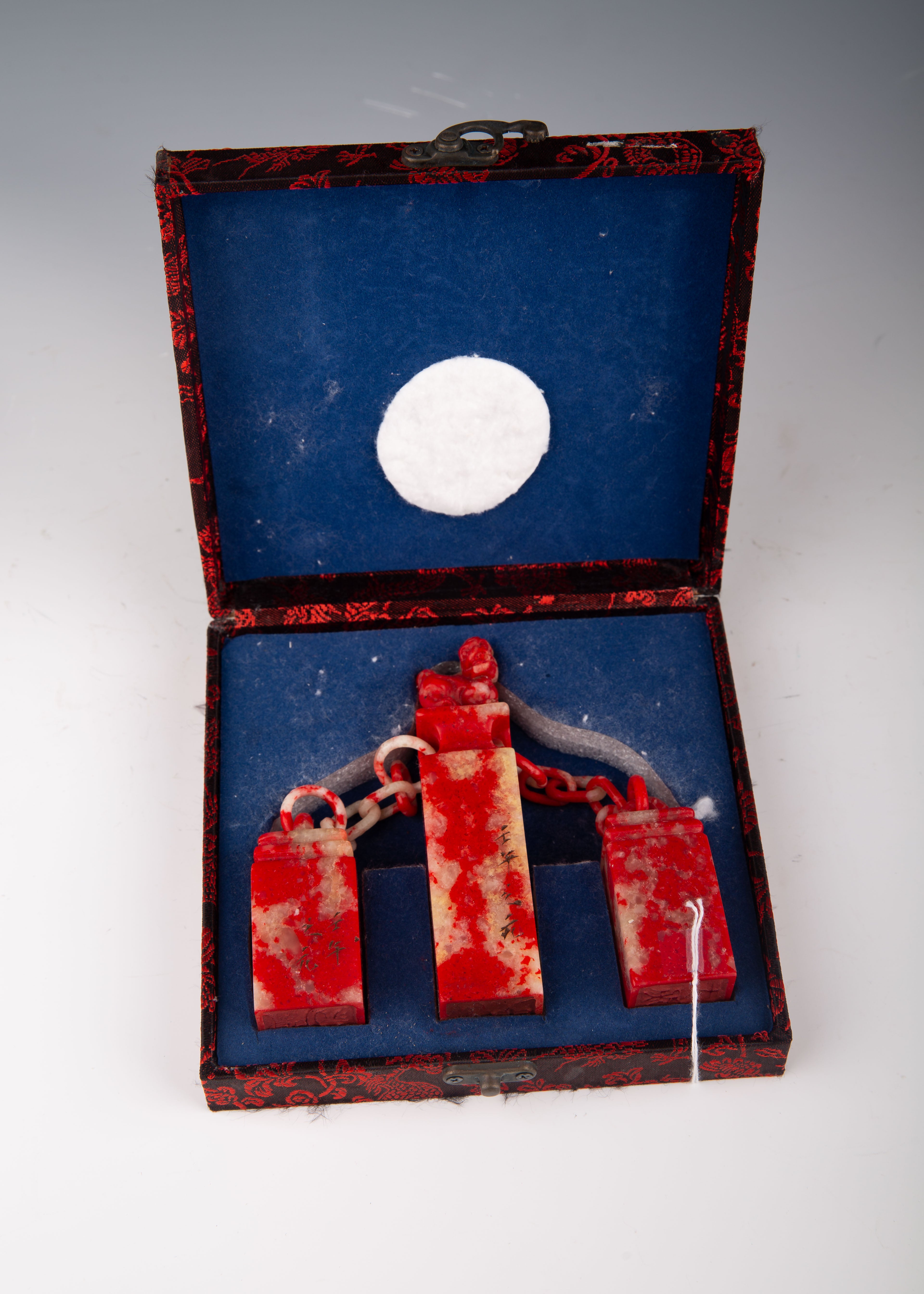 Three Chinese Jixue Blood Stone Seals Linked by Chain in Original Box