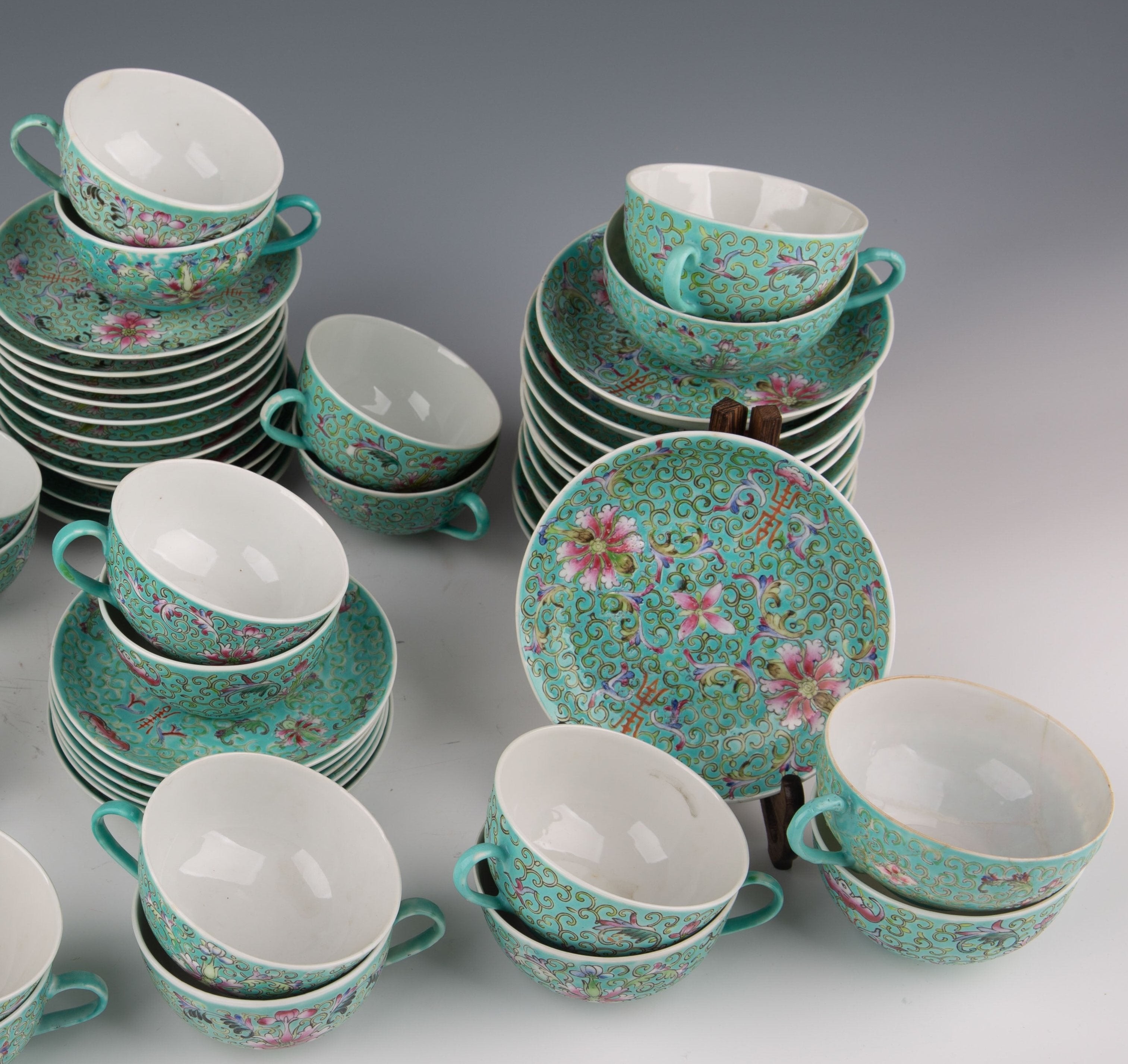 A set of Chinese pink porcelain tea sets: 24 cups and 37 saucers