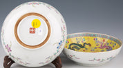 A pair of Chinese porcelain dragon bowls