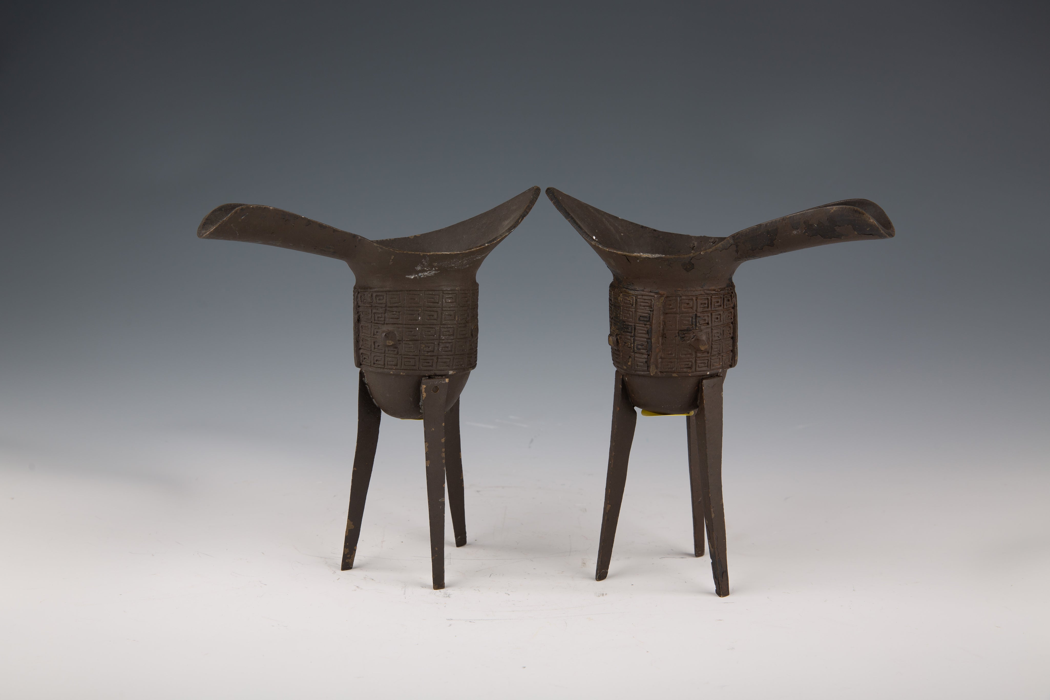 Pair of Qing Dynasty Bronze Libation Cups (Jue) with Moulding Cup