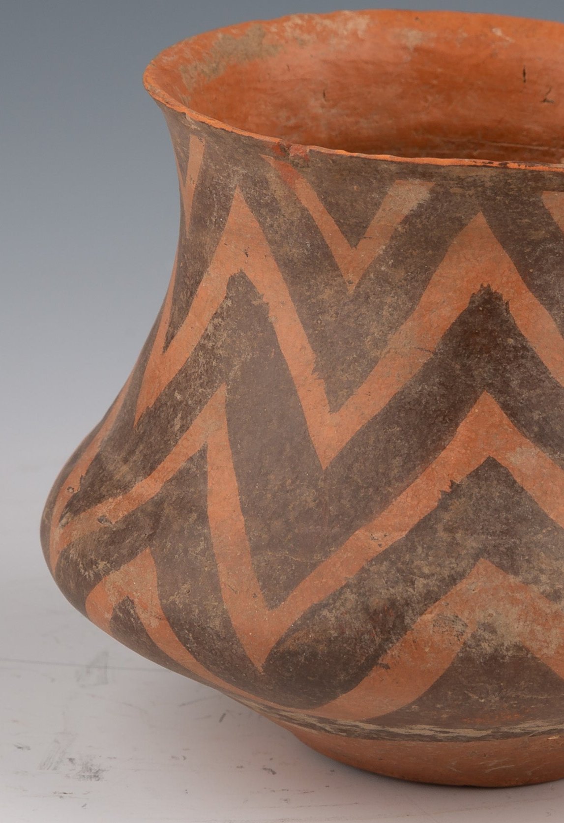 Clay Vessel with Ochre and Brown Geometric Decorations