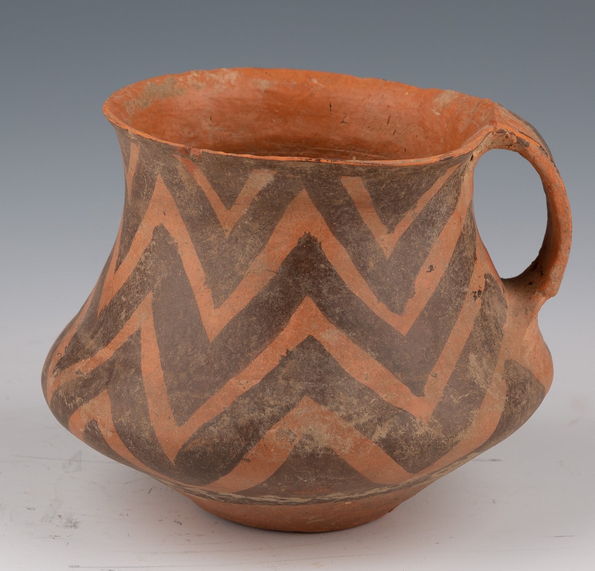 Clay Vessel with Ochre and Brown Geometric Decorations