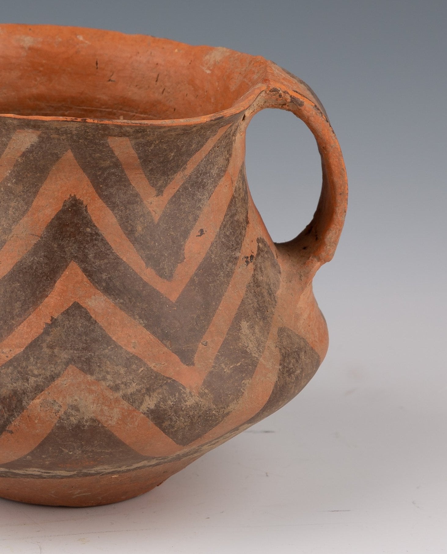 Clay Vessel with Ochre and Brown Geometric Decorations