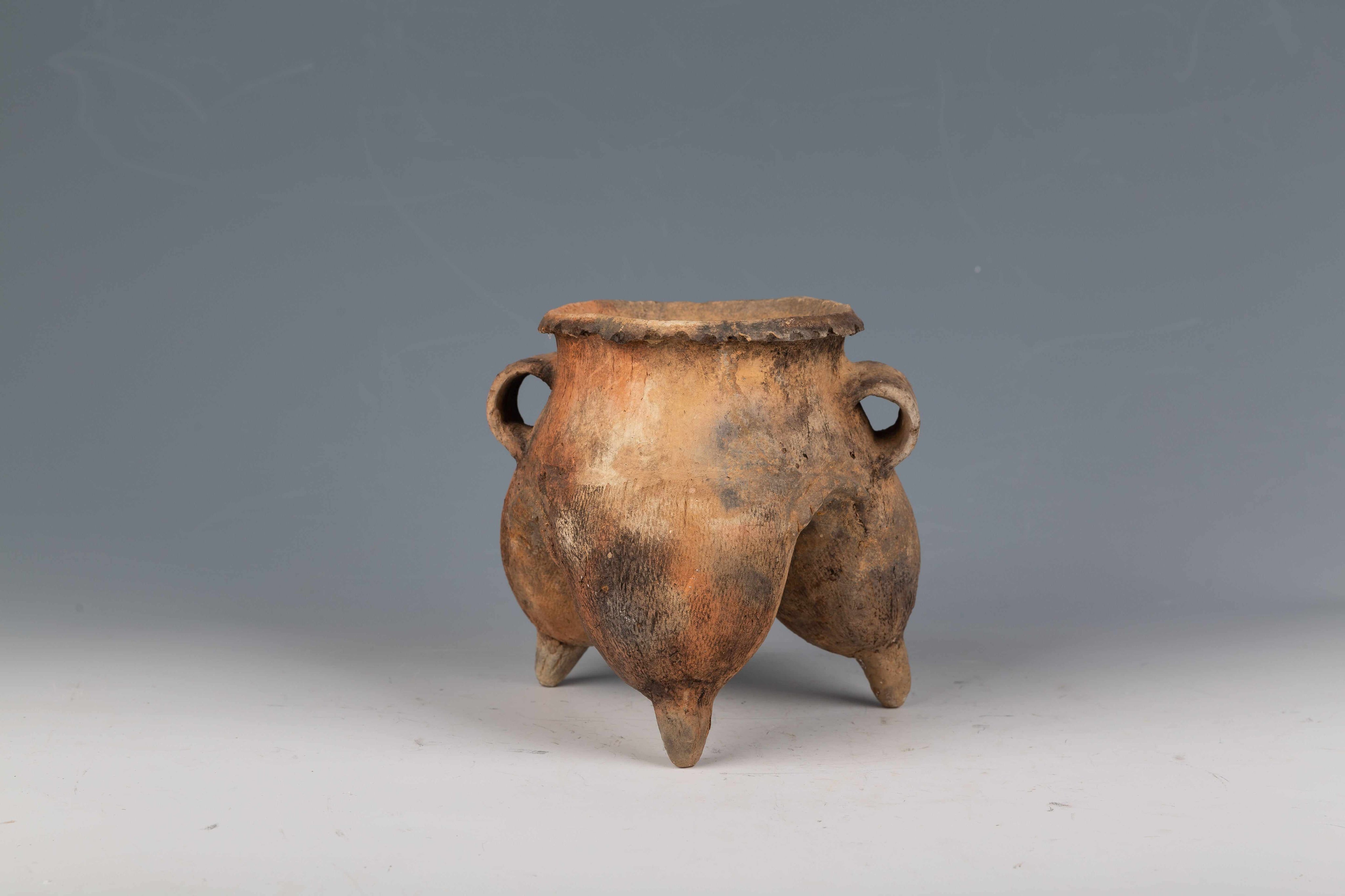 Pottery Vessel with "Wine Skin" Legs