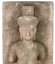 A Khmer style sandstone relief panel depicting a male deity