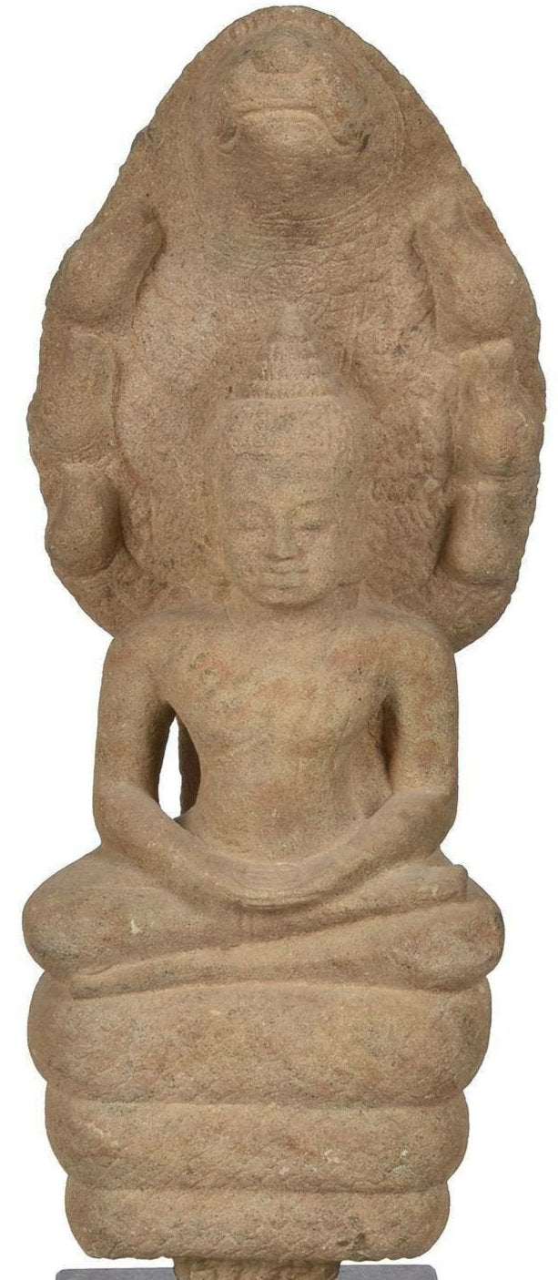 A Khmer Sandstone Figure of Buddha Sheltered by the Seven-Headed Cobra Mucalinda