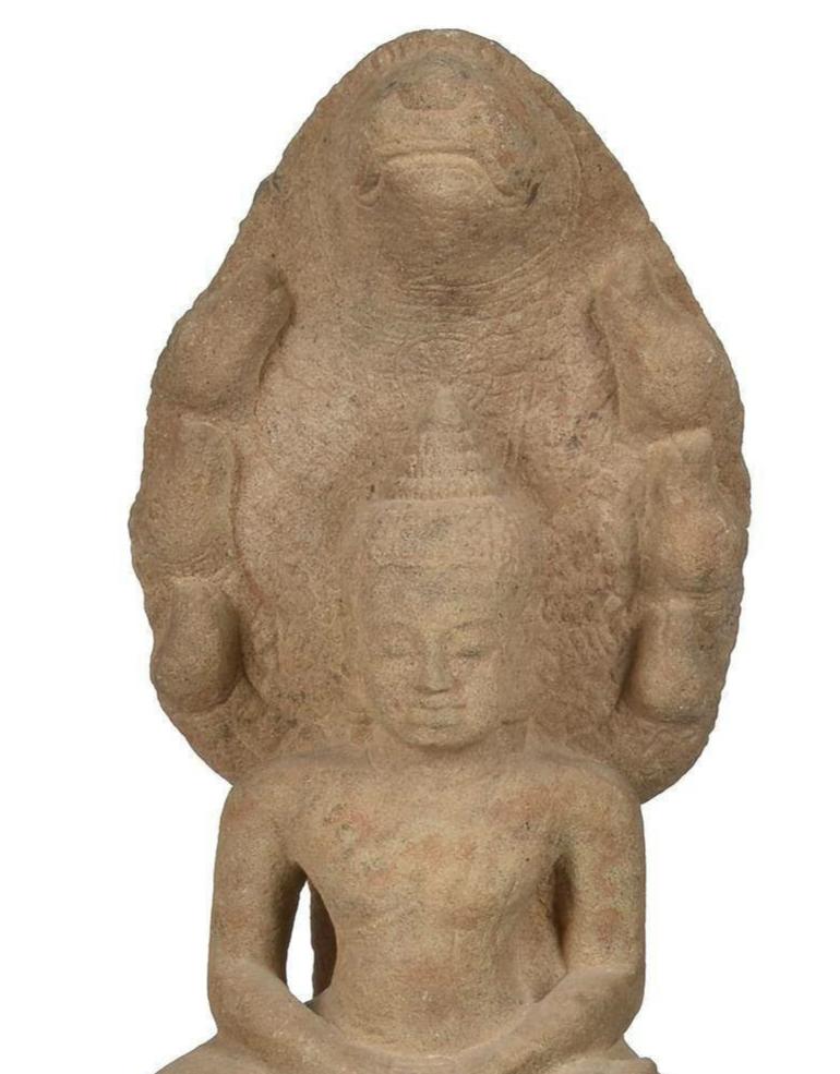 A Khmer Sandstone Figure of Buddha Sheltered by the Seven-Headed Cobra Mucalinda