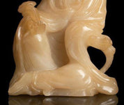 Pale Yellow Soapstone Carving of a Seated Guanyin