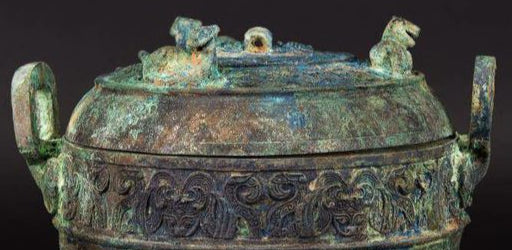 A Bronze Ritual Tripod Vessel and Cover (Ding)