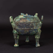 A Bronze Ritual Tripod Vessel and Cover (Ding)